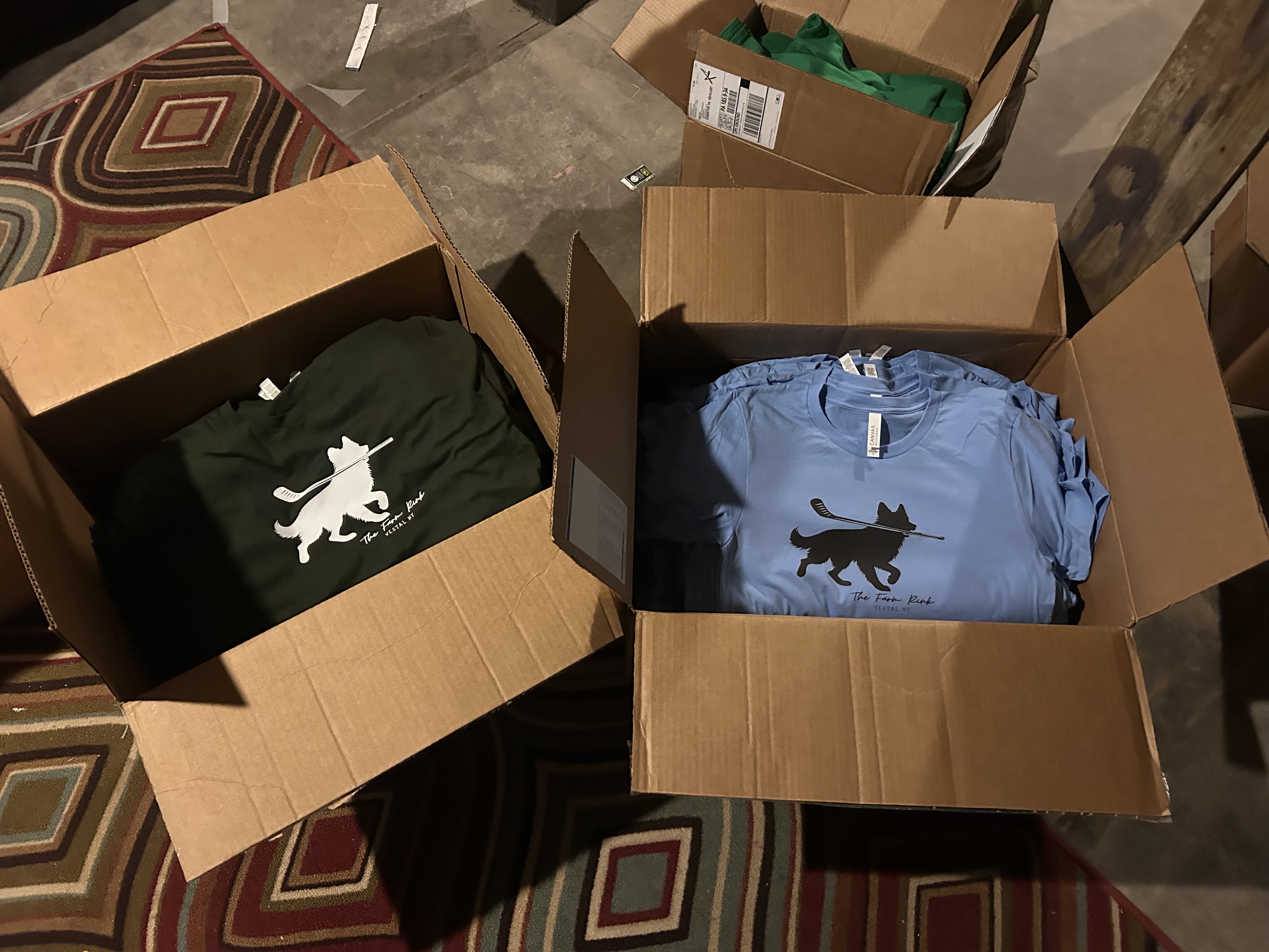 Stacks of boxed custom shirts prepared for clients