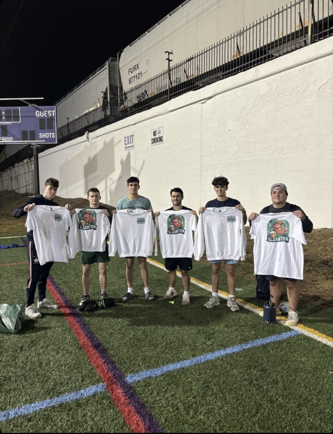 Scranton rugby players wearing matching green shirts